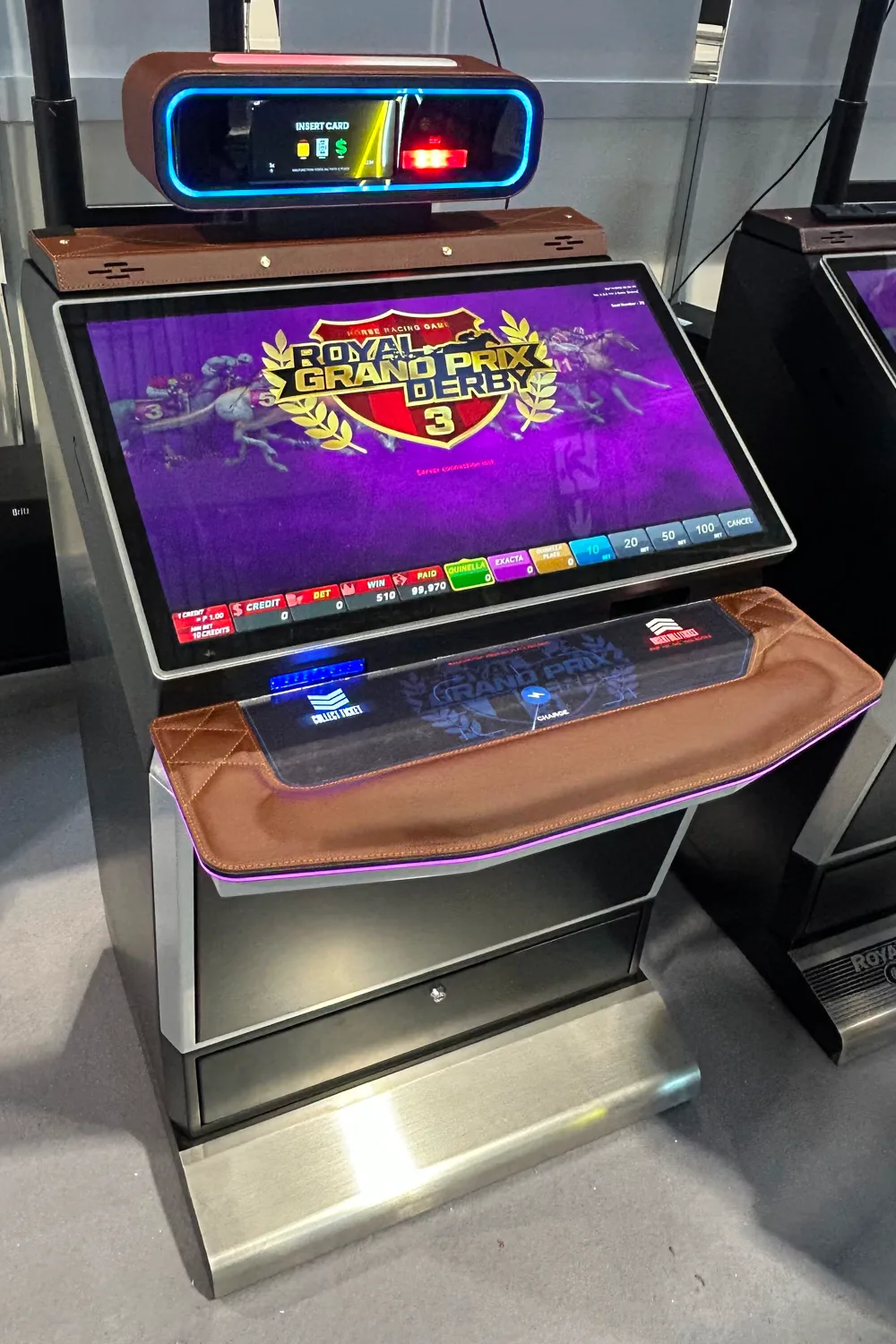 Royal Grand Prix Derby 3 production cabinet, angle view, Type B finish, photographed at G2E Asia 2026